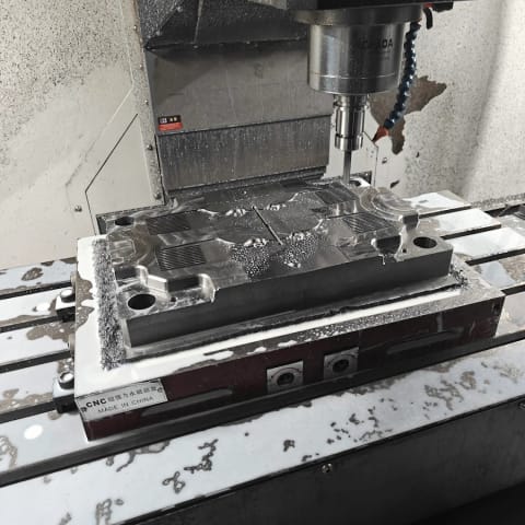 Large steel mould plate being machined on a vertical machining centre