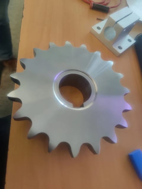 Freshly machined sprocket with cut teeth and a bored centre