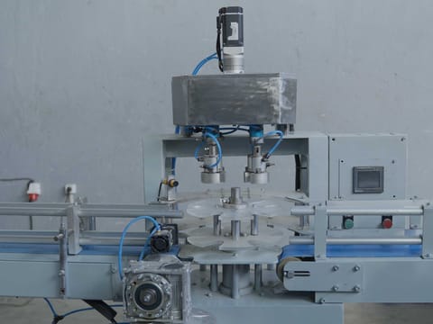 Rotary filling and capping station with stainless steel head